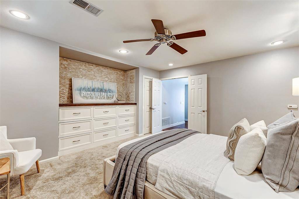 Custom cabinetry enhances the primary bedroom.