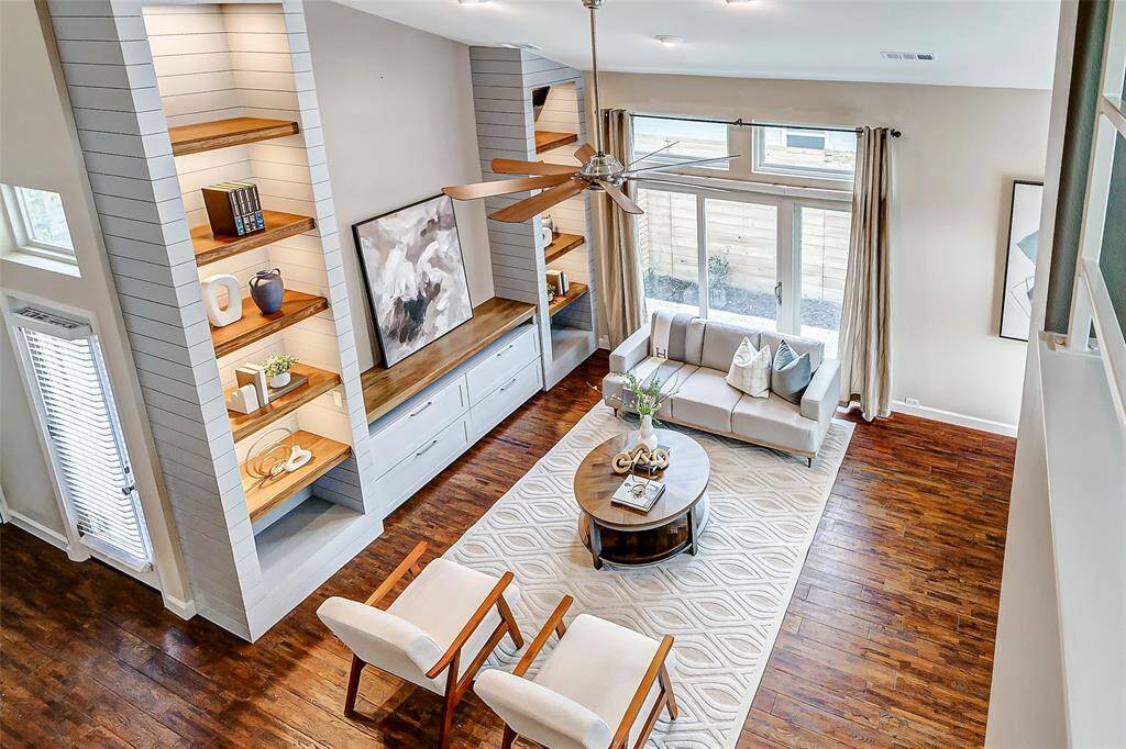 View of the inviting living room from the cozy second-floor office nook.