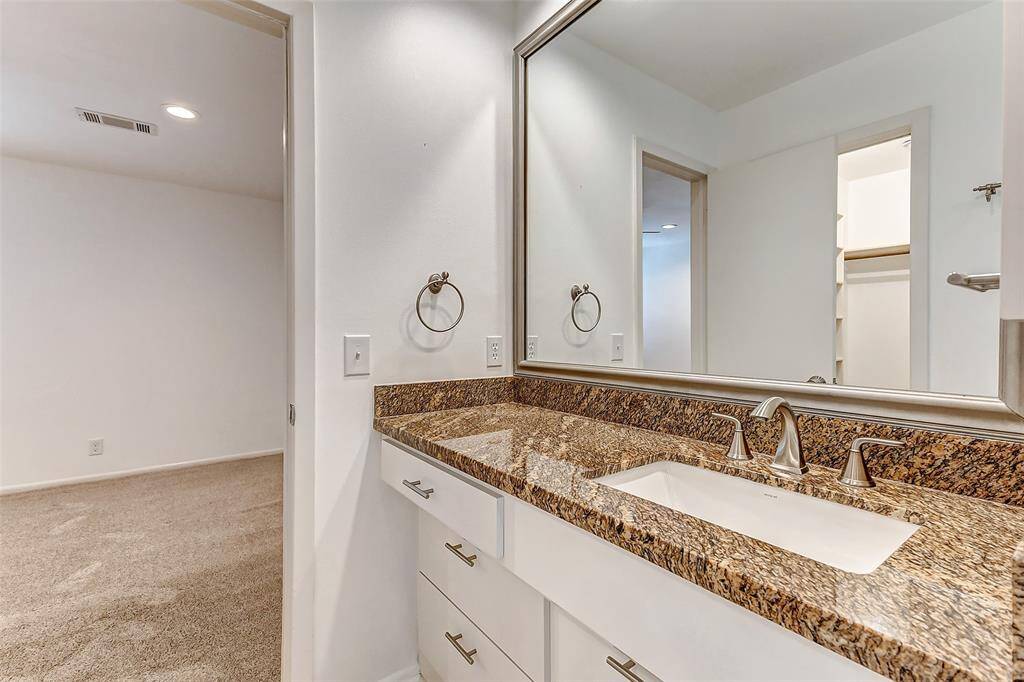 Enjoy direct access to a Jack-and-Jill bathroom and a spacious walk-in closet in this charming upstairs bedroom.