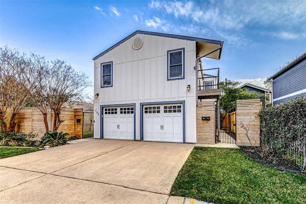 Experience convenience and privacy in the garage apartment, featuring a kitchen, bathroom, walk-in closet, and a versatile living/bedroom space, all with its own street entrance.