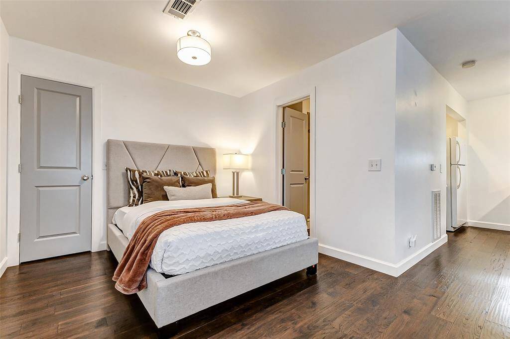 Adjacent to the sleeping area is a spacious full bathroom with a convenient walk-in closet.
