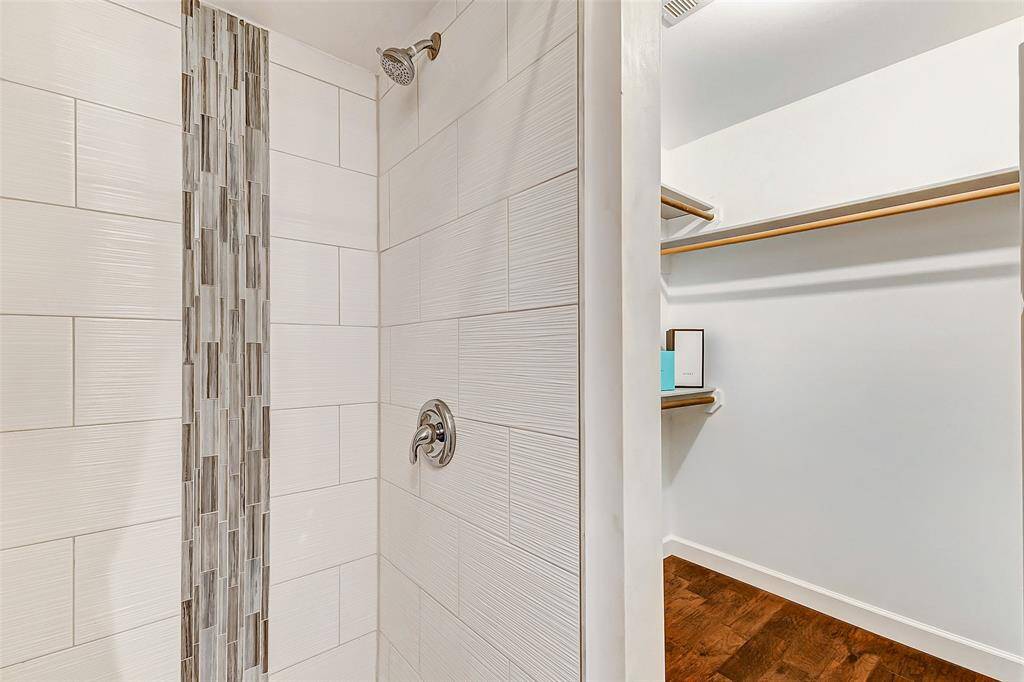 Modernized shower in the garage apartment for added comfort and style.
