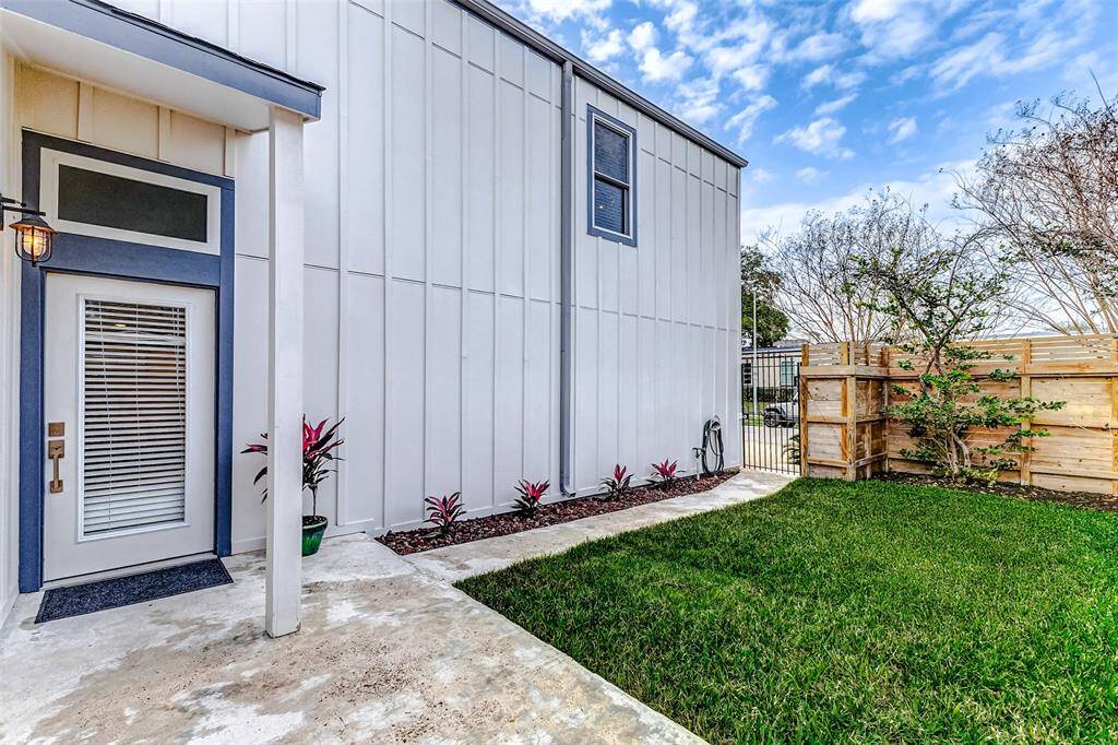 Private main entrance through a serene grassy courtyard.