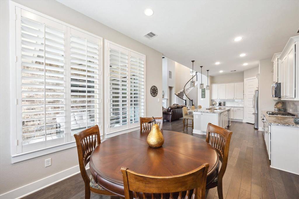 Enjoy seamless dining with access to the chef's kitchen and direct views to the patio.