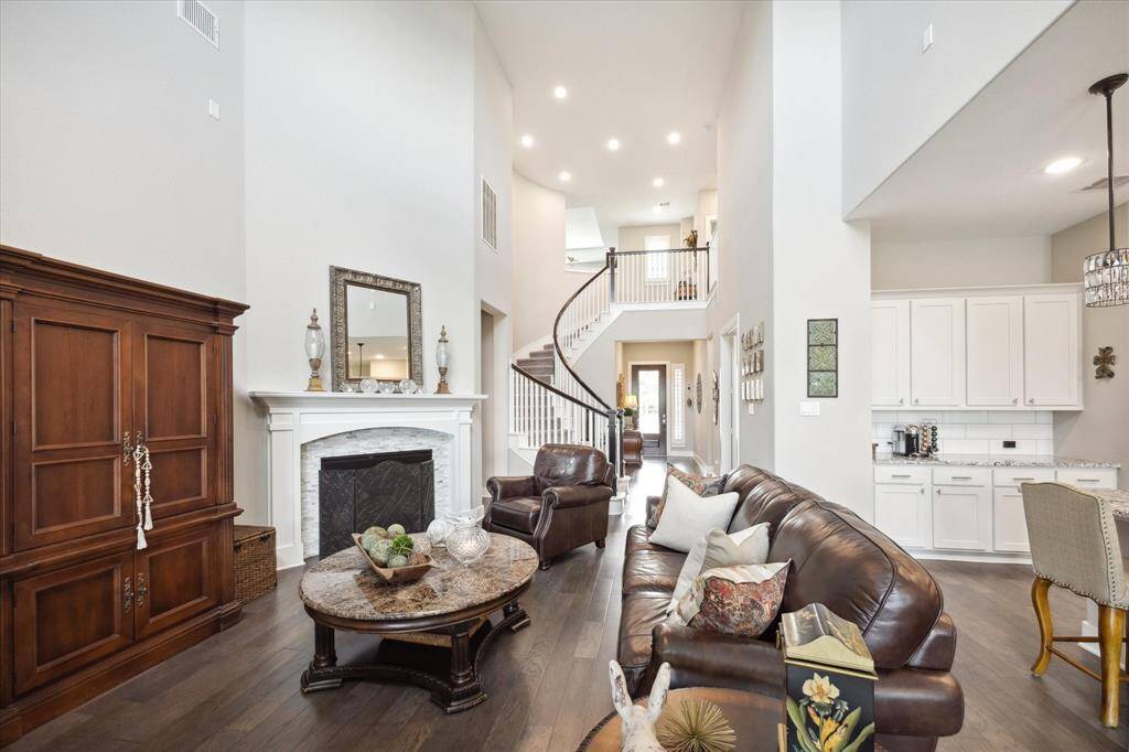 Inviting family room featuring an elegant fireplace.