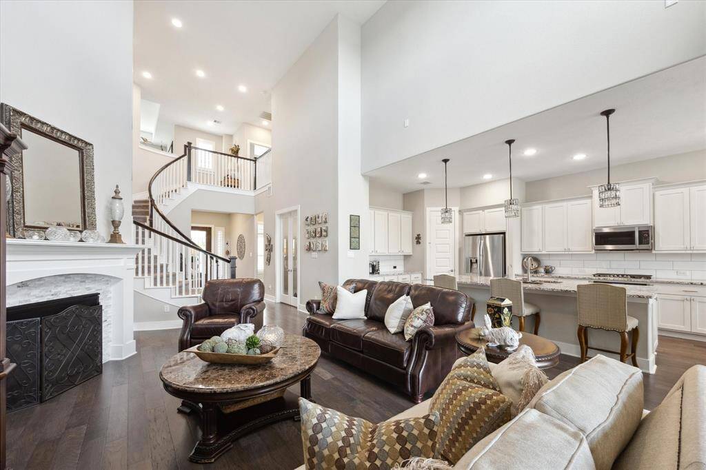 Spacious open-concept family room and kitchen with a large island.