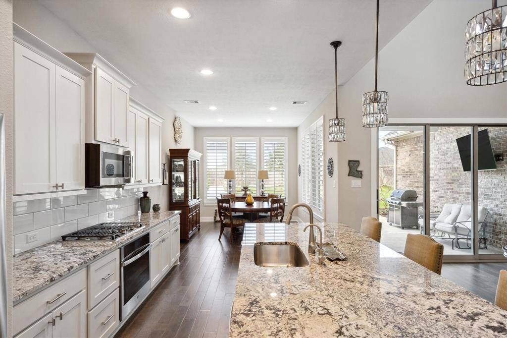 Enjoy top-of-the-line GE Profile appliances, featuring a dishwasher, gas cooktop, convection oven, and advanced microwave with Advantium technology.