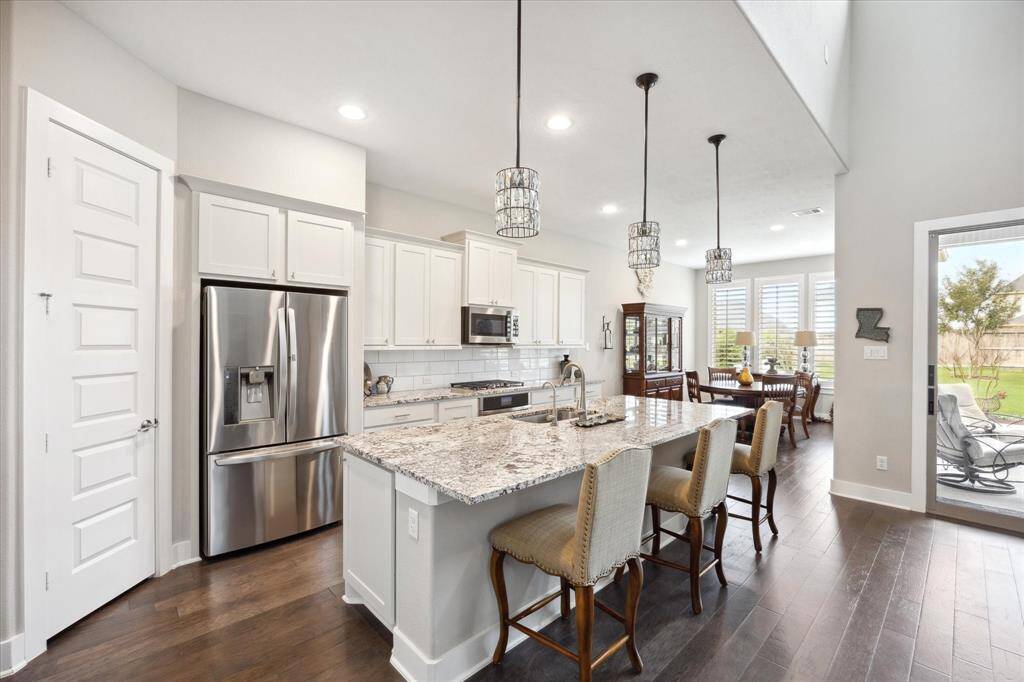 Gather with friends around the spacious island for casual dining and conversation.