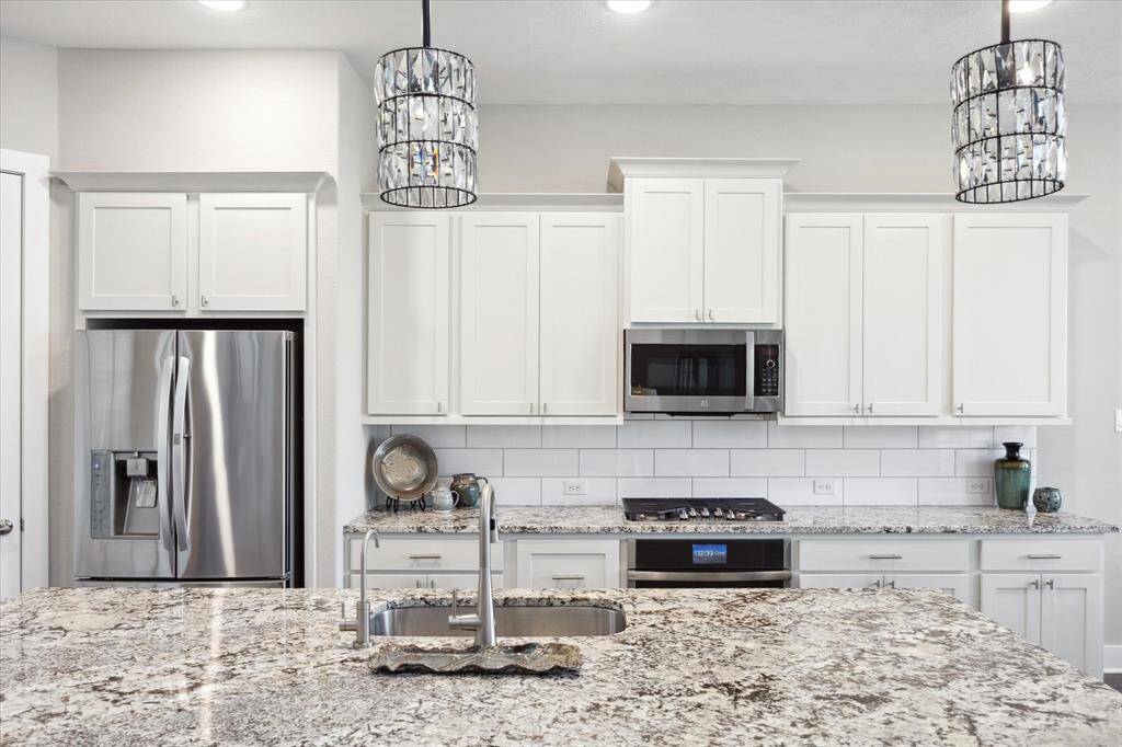 Ample storage space with sleek cabinetry for all your kitchen essentials.