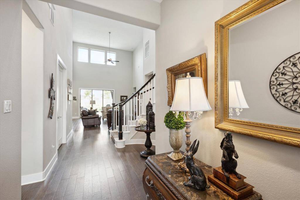 Inviting foyer with elegant decor and abundant natural light.