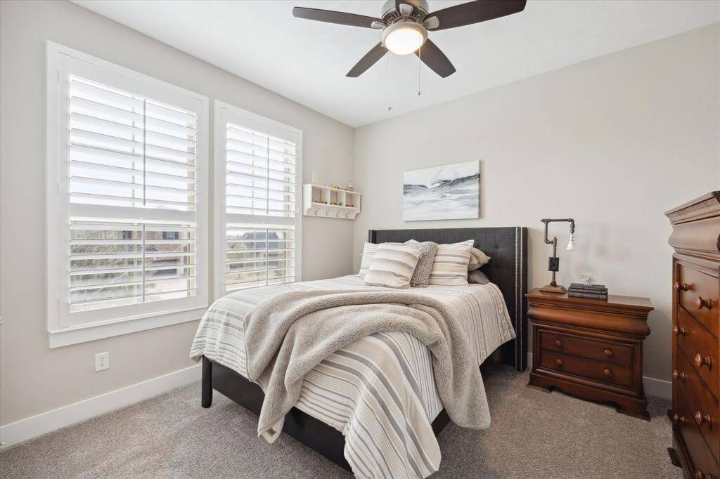 Upstairs bedroom 4 with ample natural light and stylish finishes.