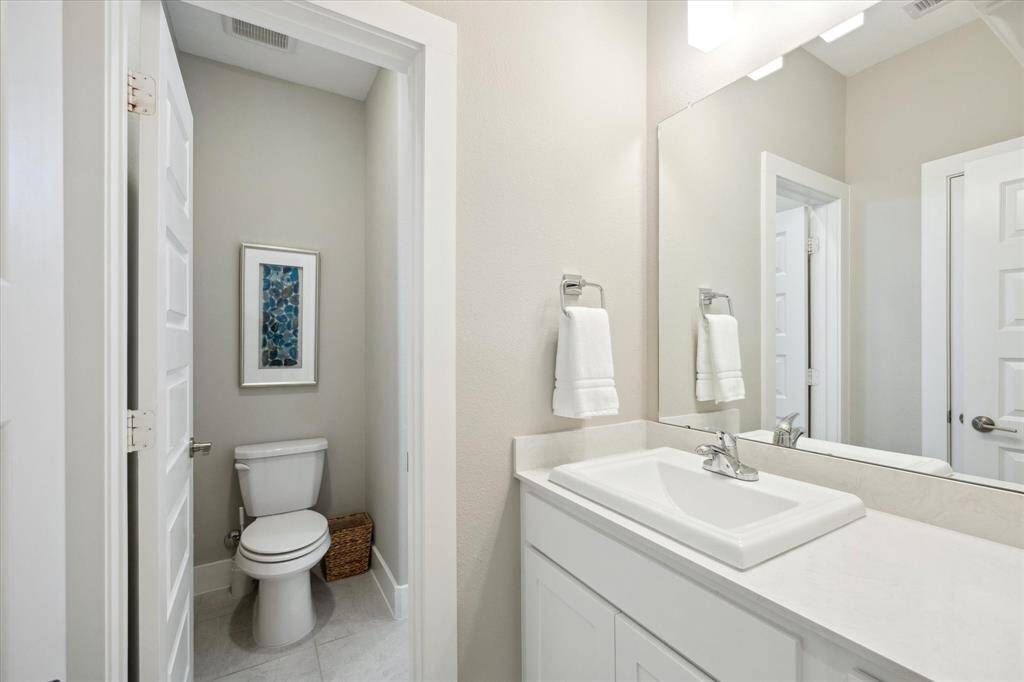 Upstairs Hollywood bath with modern fixtures and a sleek design.