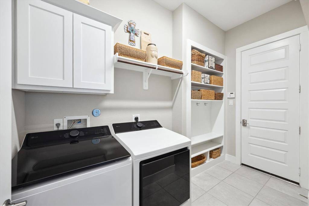 Efficient laundry room with ample open storage for easy organization.