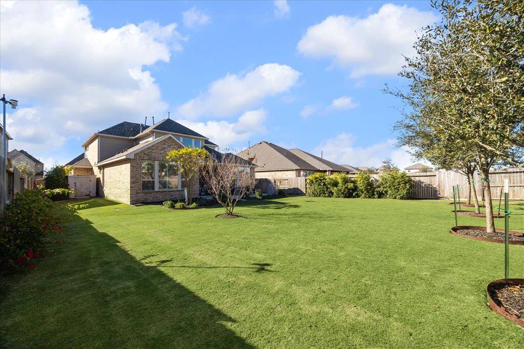 Enjoy a spacious backyard on this expansive 10,599 sq ft lot.