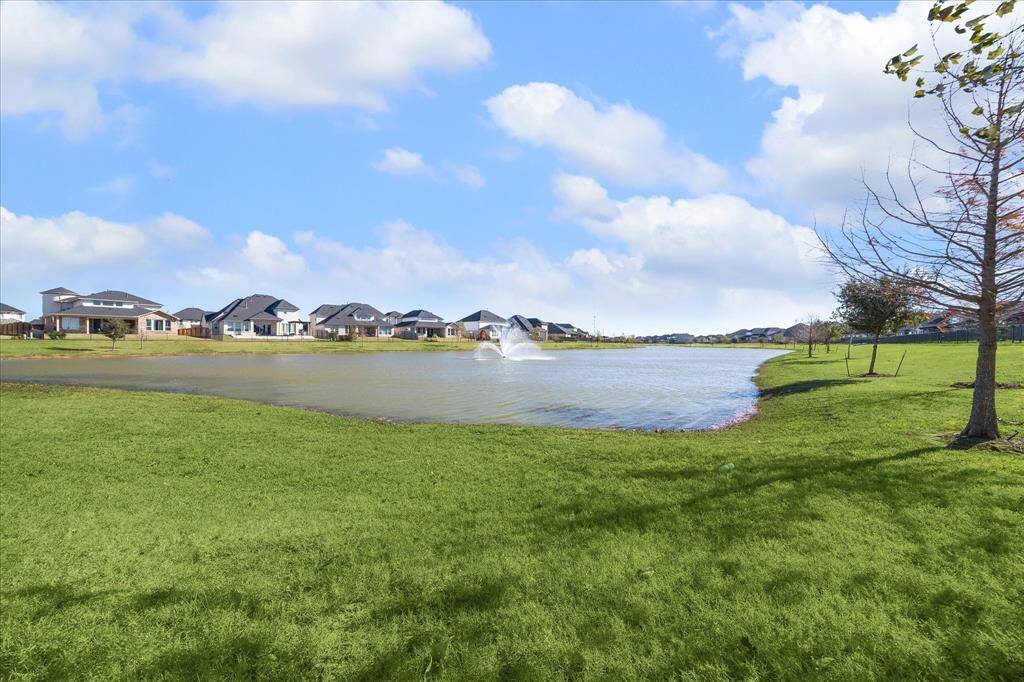 Tranquil neighborhood lake with scenic views and serene surroundings.
