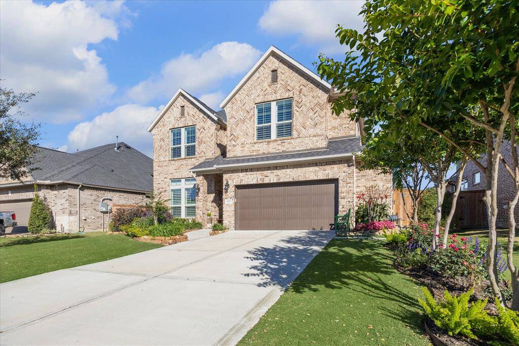 Spacious double-wide driveway for ample parking.