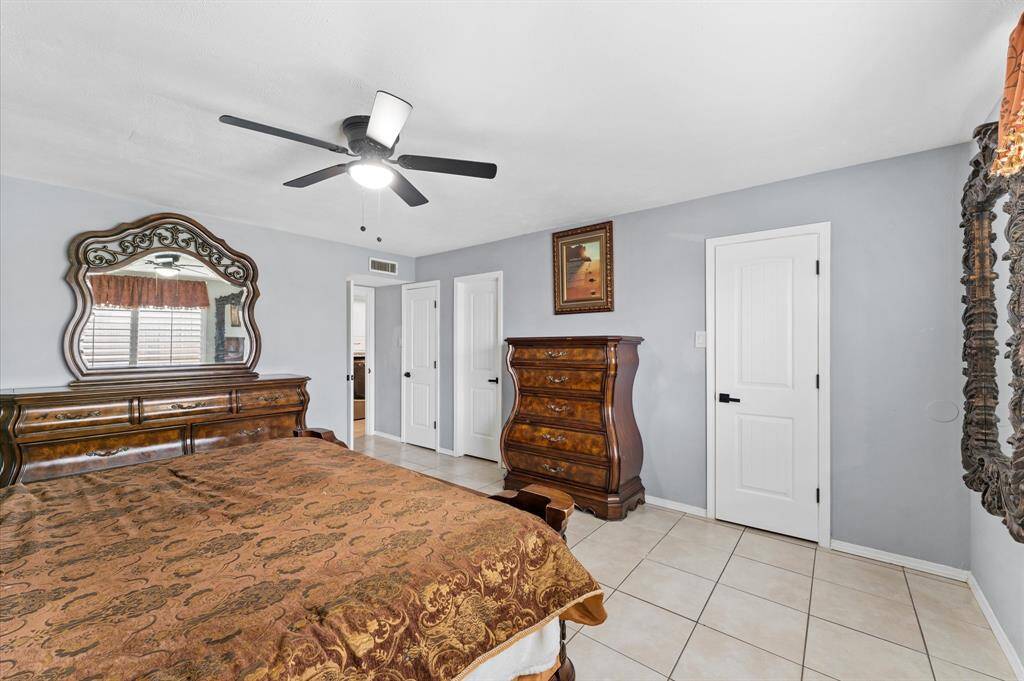Bright, spacious bedroom with new windows and fresh paint.