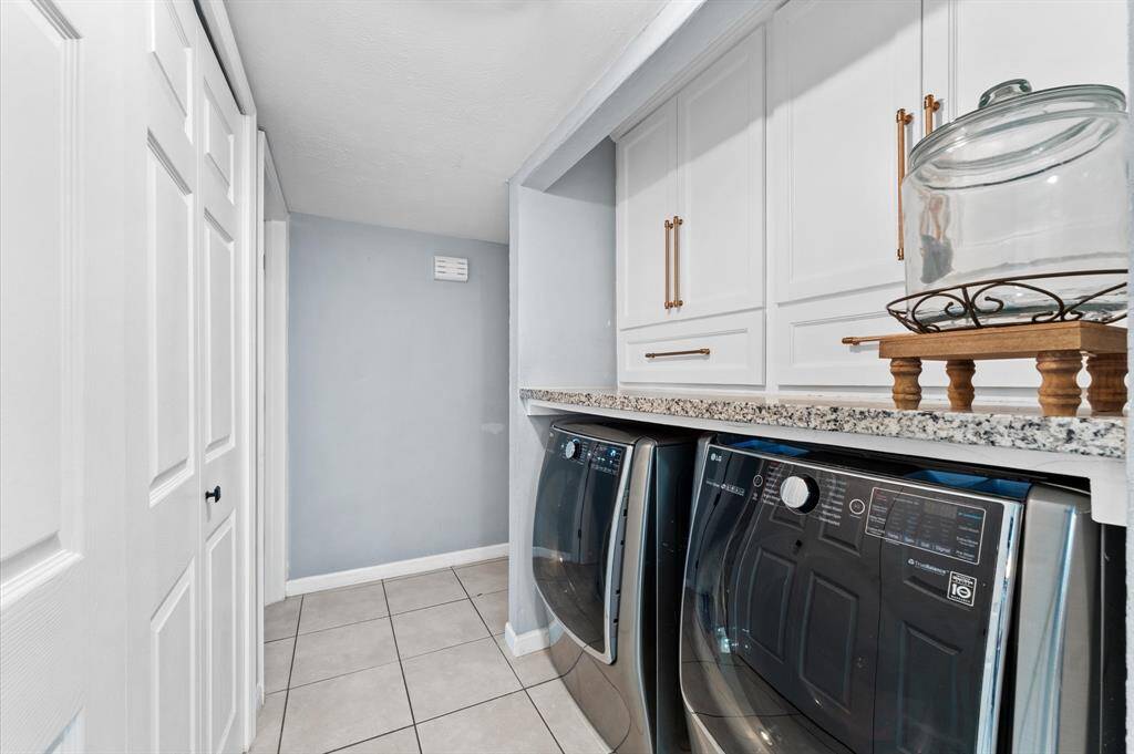 Brand-new cabinetry in the laundry room for extra storage.