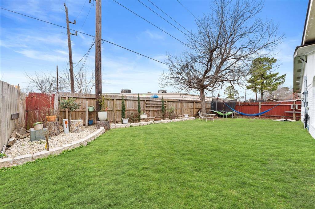 Spacious backyard with plenty of room for outdoor activities.