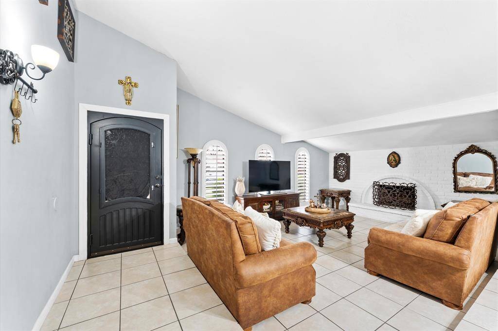 Step inside to an inviting open-concept living space with fresh paint, modern finishes, and no carpet for easy maintenance.