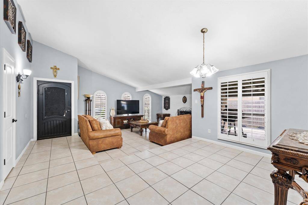 Step inside to an inviting open-concept living space with fresh paint, modern finishes, and no carpet for easy maintenance.