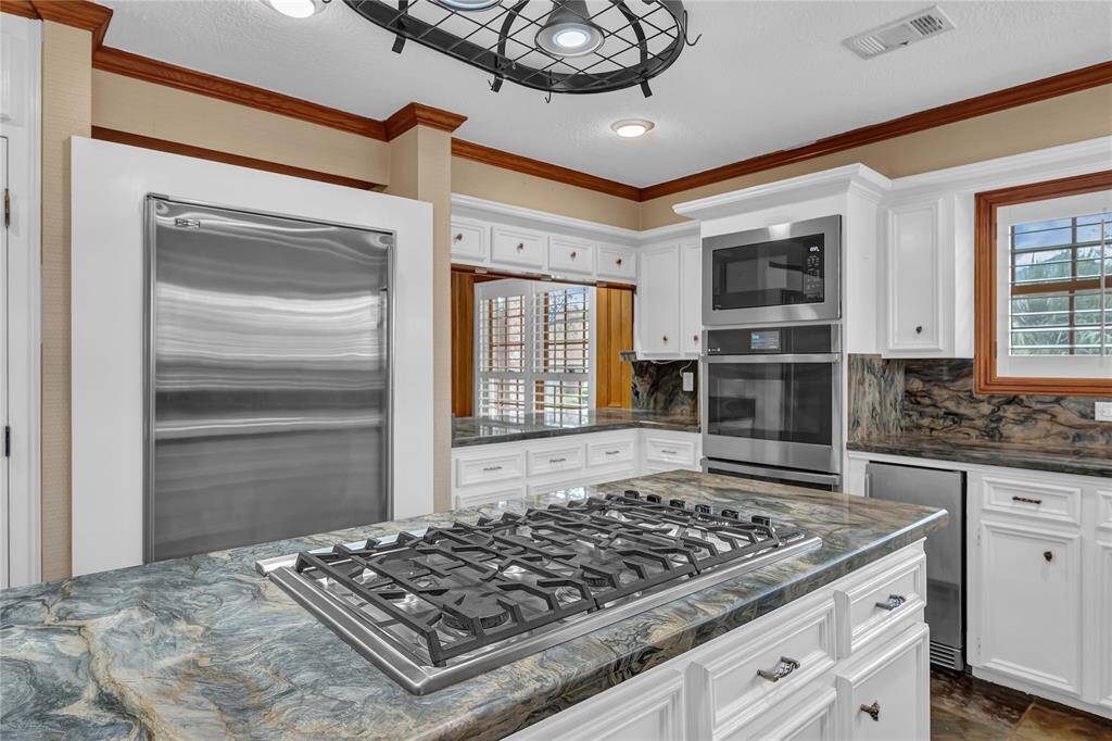 *New Thor ice-machine with built-in pump ($1700). Viking 6-burner Cooktop. Subzero refrigerator. Island storage, dual pantries and wine refrigerator.