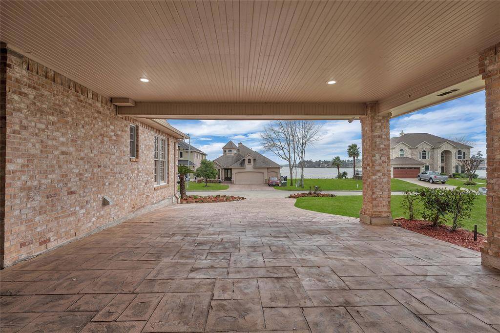 *Newer 5 inch thick with rebar and stamped tile with color (33K). Full size carport has recessed lighting and wood paneling.