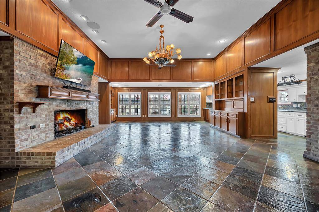 *Living room has extensive Built-Ins, extensive wood work, floor outlets, surround sound speakers and lighted display cases.