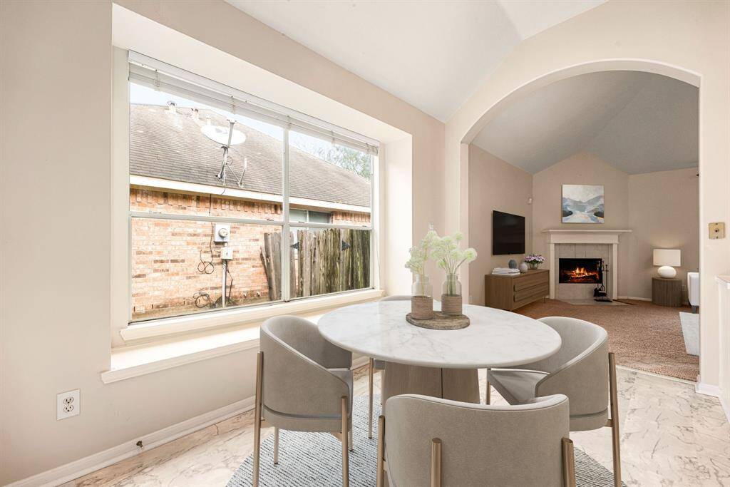 Start your day off right with a cup of coffee sitting with your family in the lovely breakfast area! Featuring large windows, custom neutral paint, tile flooring, recessed lighting and high ceilings. *Virtually Staged