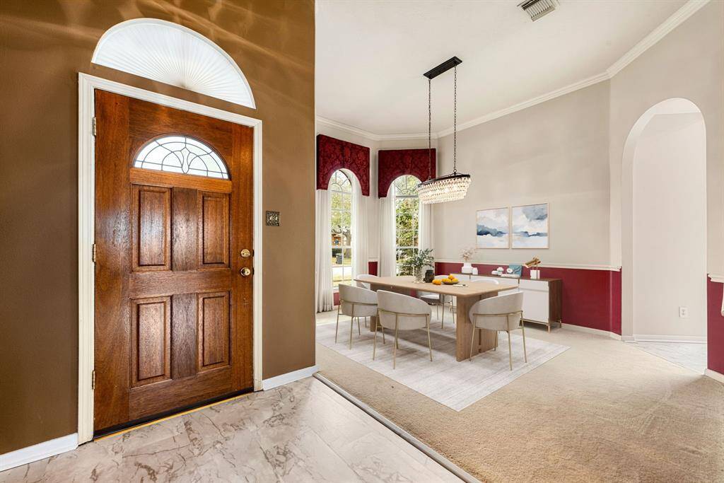You and your guests will certainly dine in style in this amazing formal dining room! Featuring a gorgeous chandelier, large window, neutral paint, high ceilings, and crown molding. Perfect space to entertain family and friends. *Virtually Staged