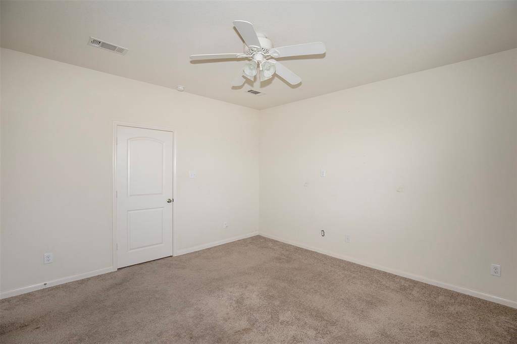 The primary suite has plenty of space for king size furniture.