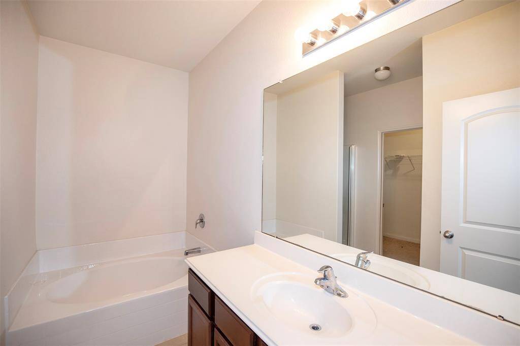 The primary en suite has a large garden tub that is a perfect place to relax after a long day.