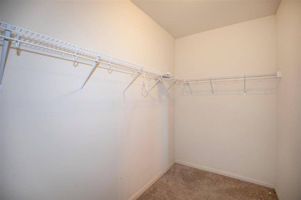 Spacious primary closet.