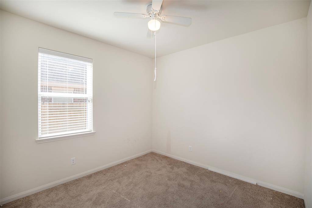 The first of two generous size secondary bedrooms.
