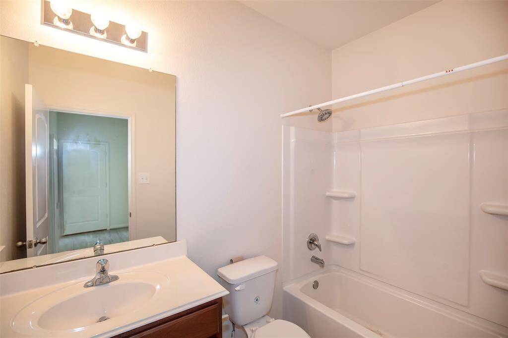 The guest bathroom is conveniently located near the secondary bedrooms.