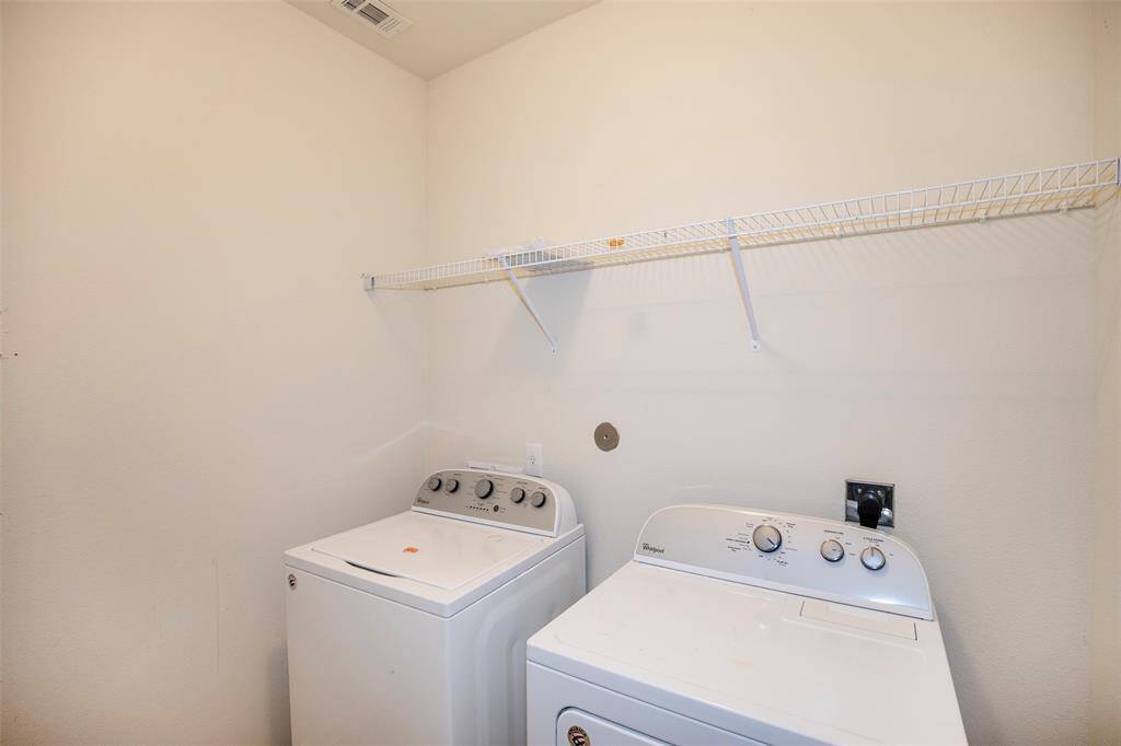 The utility room is centrally located near the secondary bedrooms.