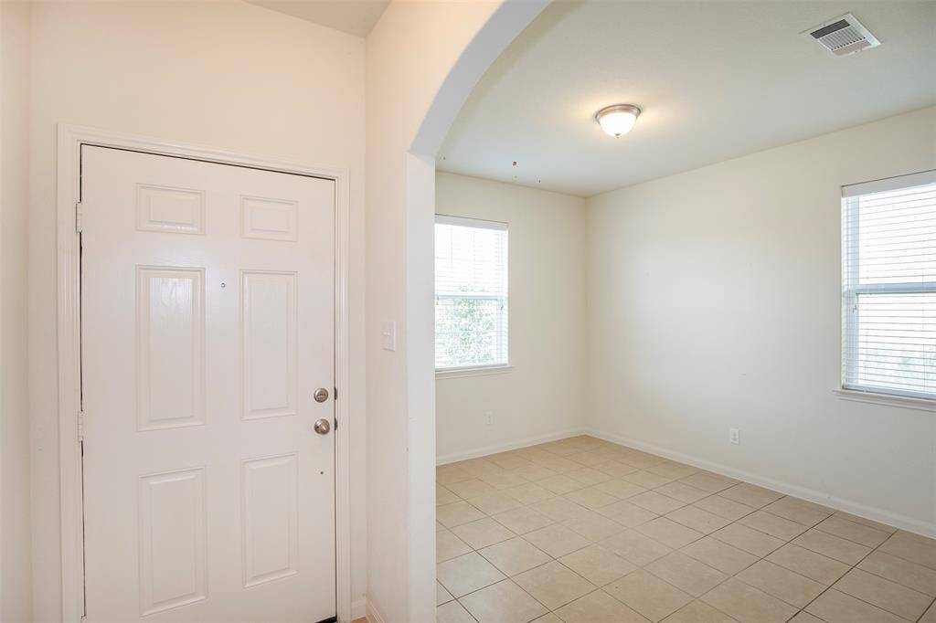 From this view of the entryway, you can see into the dining area.