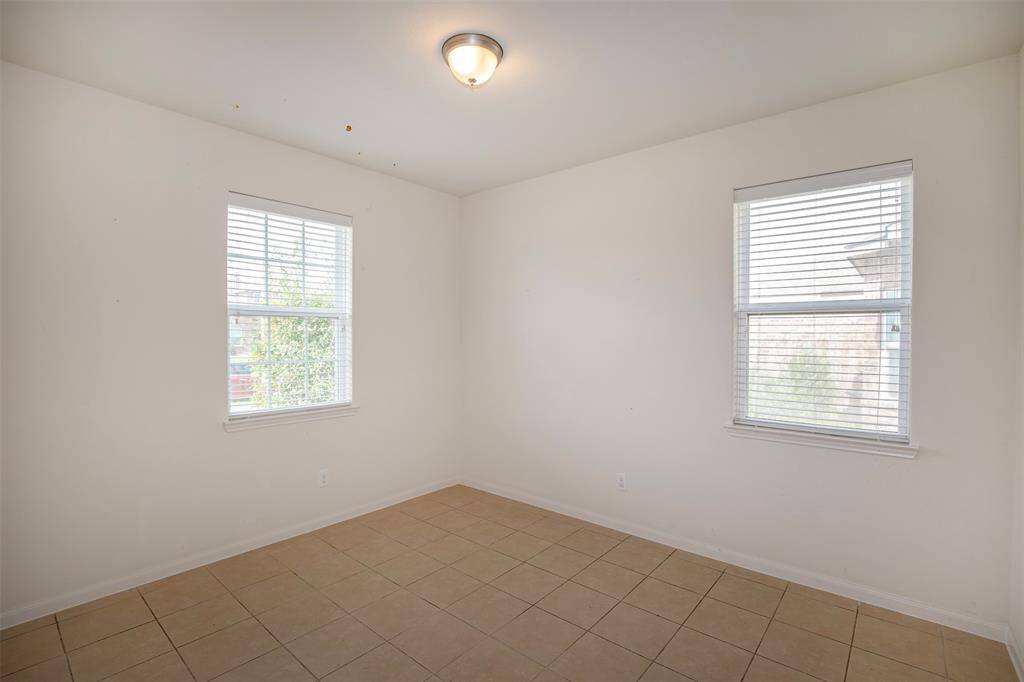 The dining area has large windows that let in the natural light.