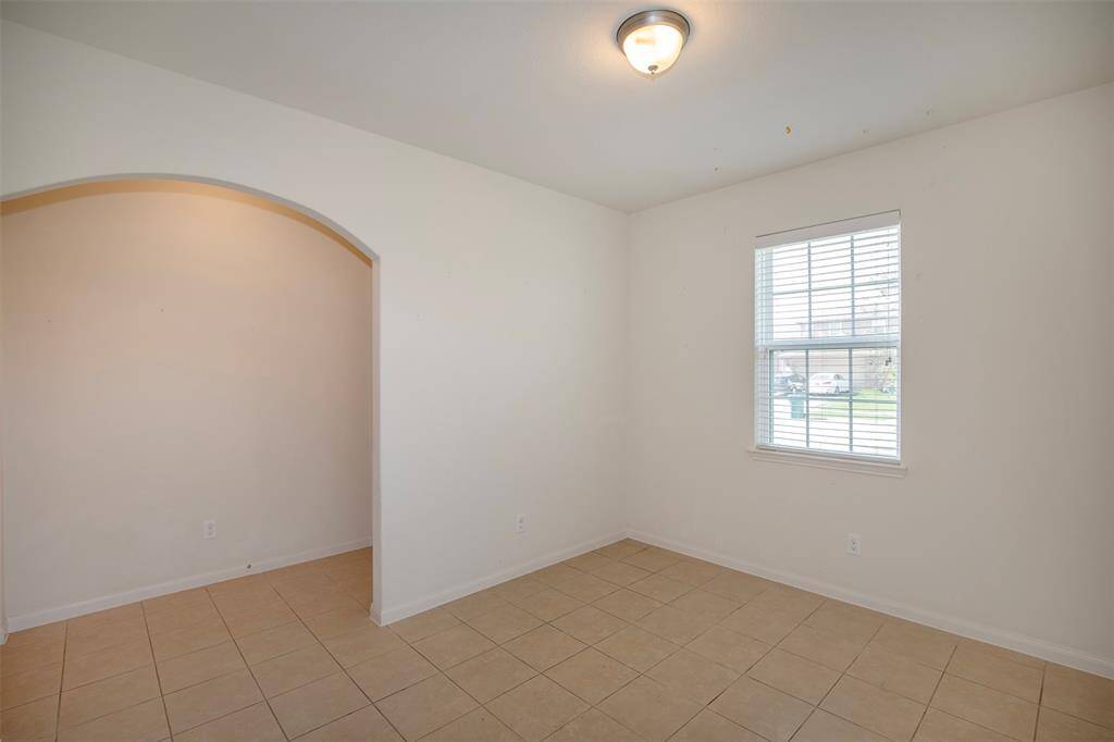 This room could be used as a dining room or a home office.