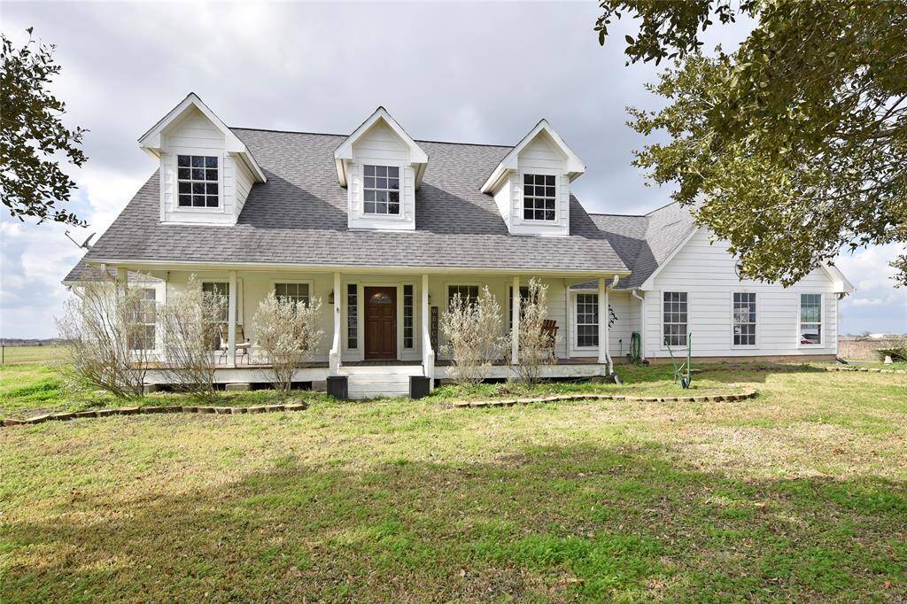 Charming country front porch, perfect for relaxing and enjoying serene views.