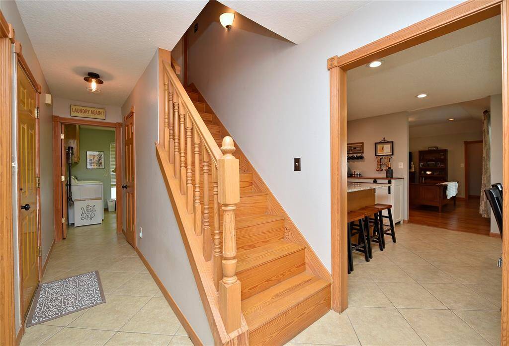 Staircase leading to a spacious, unfinished attic—ideal for custom expansion.