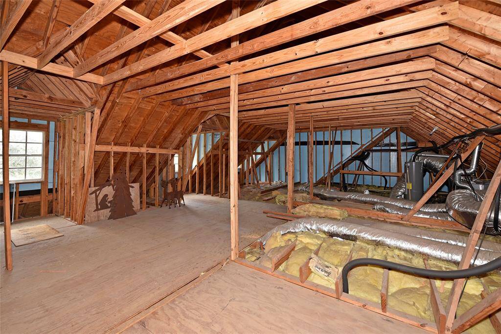 Spacious floored attic with plumbing and electrical ready for easy expansion.