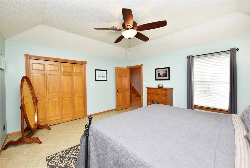Elegant doors open to a versatile craft room.