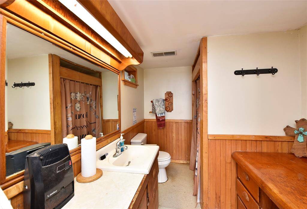 Experience rustic charm with a fully equipped bathroom in the barn, offering convenience and style.