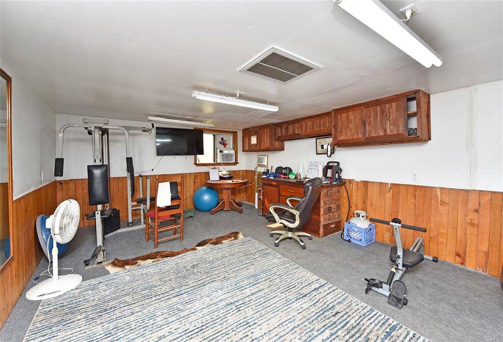 Versatile barn room currently set up as a home gym.