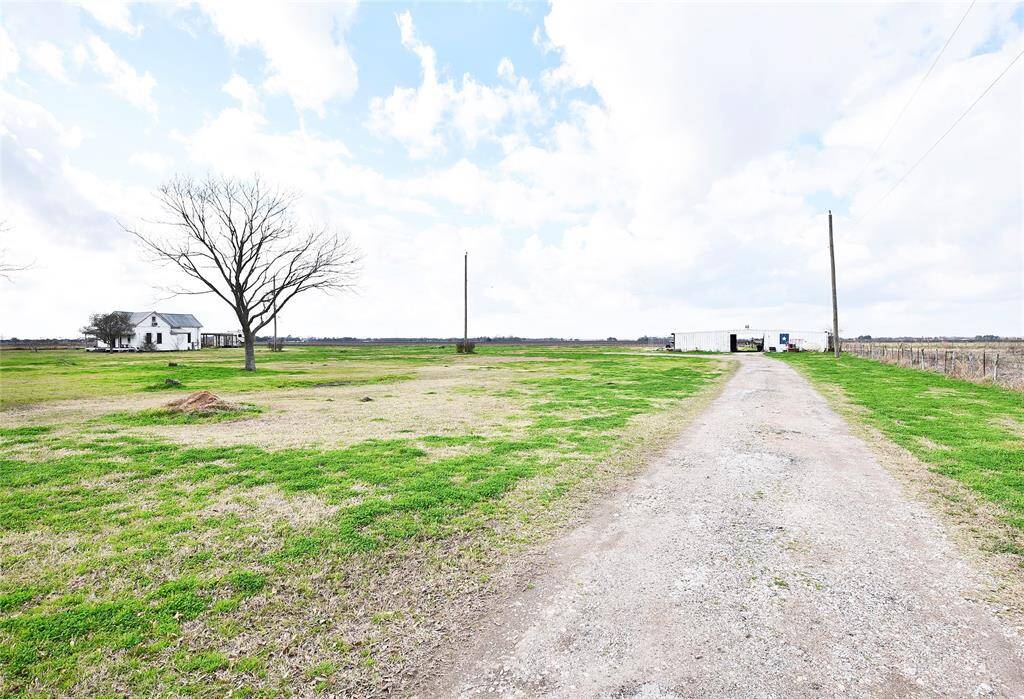 Expansive property featuring a versatile AG barn with ample equipment storage space.