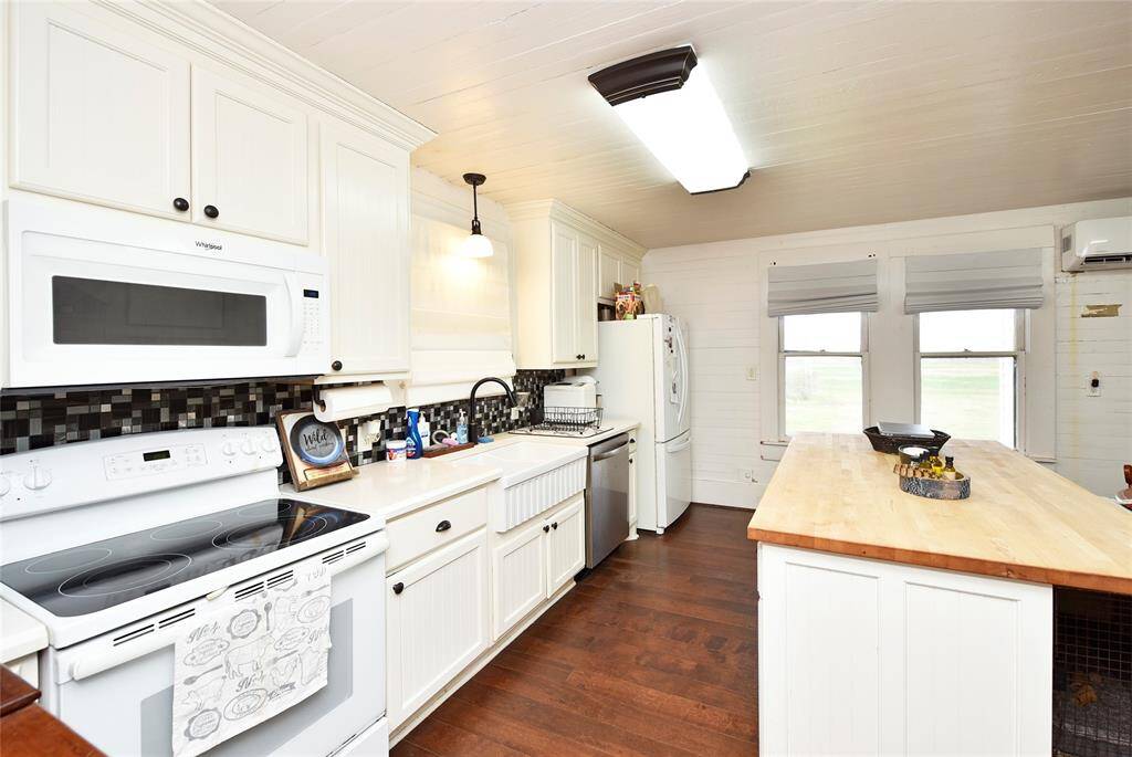 Charming guest house kitchen featuring modern appliances, ample counter space, and inviting natural light. Perfect for entertaining or cozy meals.