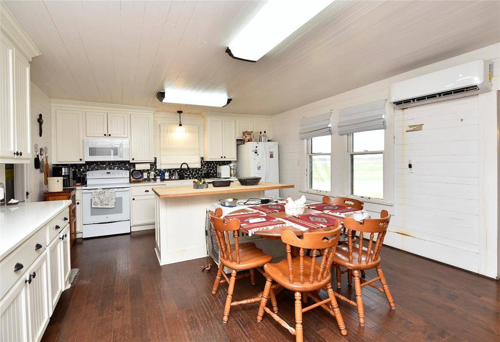Cozy dining area with natural light and charming wood accents, perfect for family gatherings.