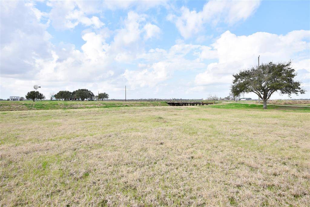 Expansive front meadow, perfect for enjoying serene country views.