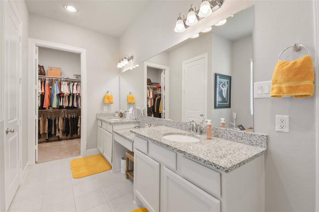 Primary has separate shower and sunken garden tub.